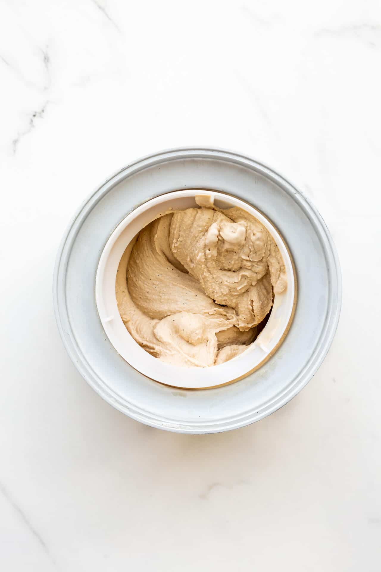 Freshly churned tea-infused ice cream in the freezer drum