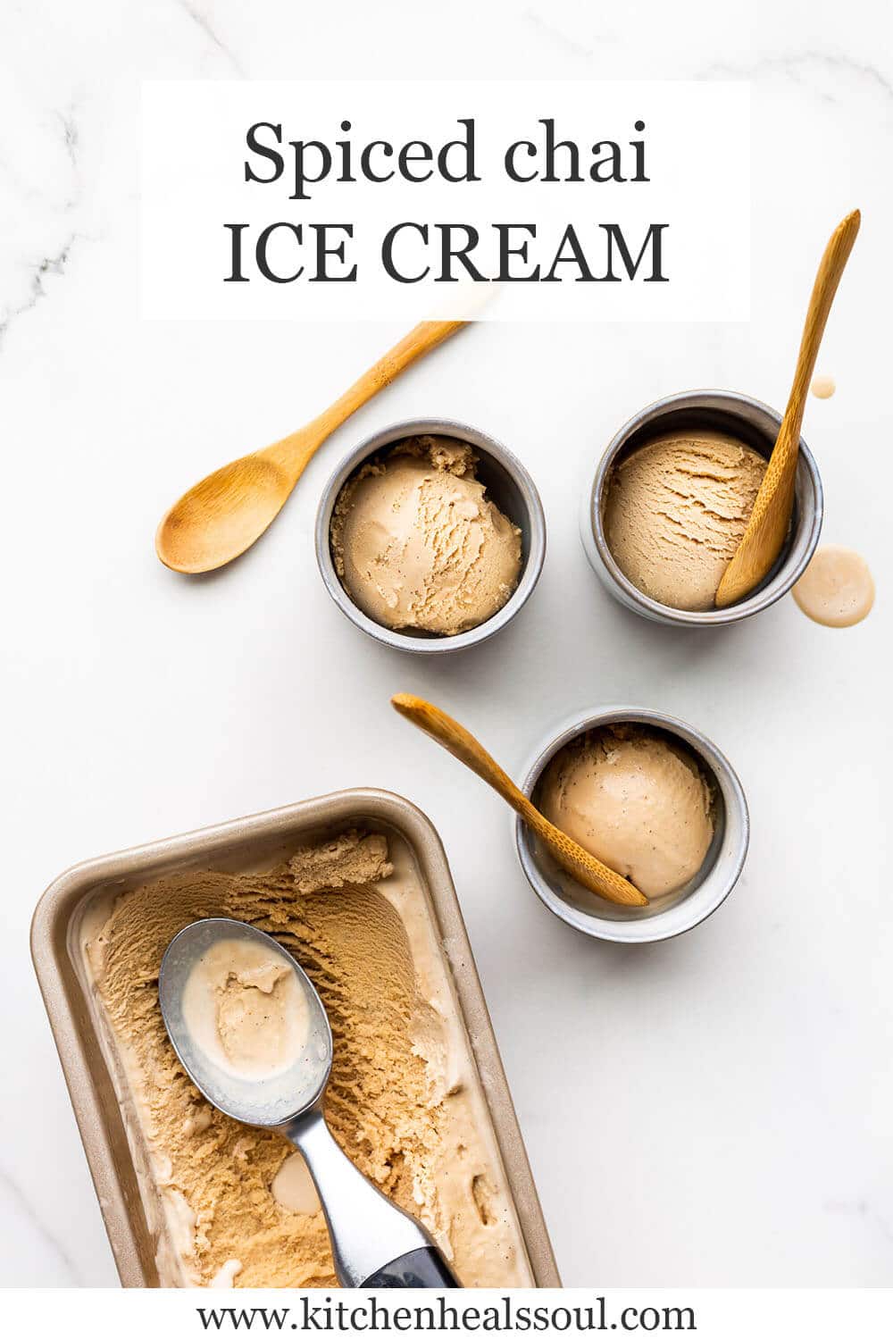 Masala chai ice cream frozen in a loaf pan and being scooped into little blue cups and served with wooden spoons