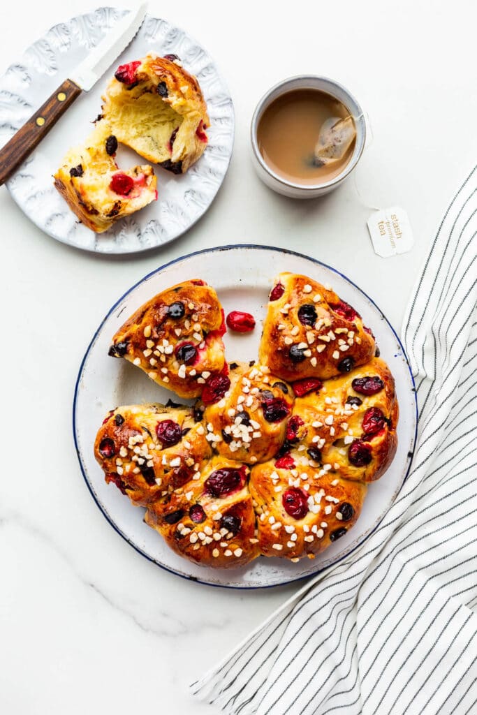 Serving cranberry chocolate chip brioche buns with tea.