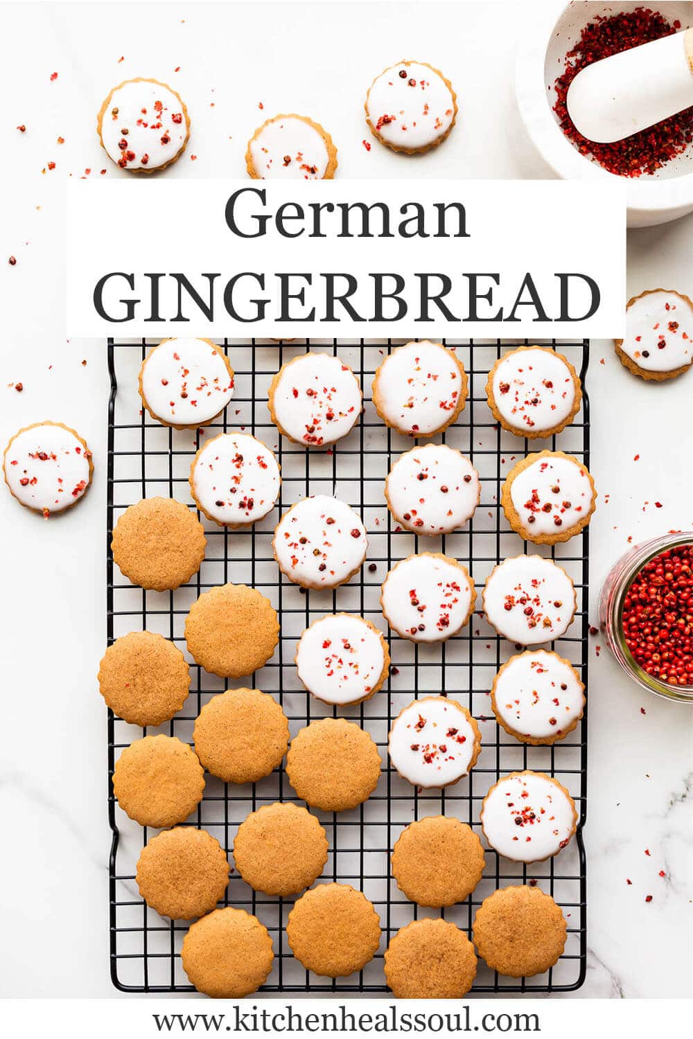 German gingerbread on a cooling rack in the process of being glazed with icing.