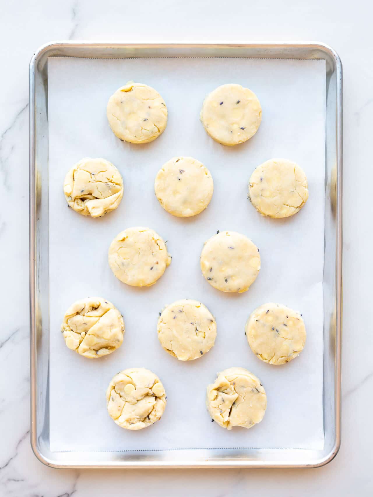 12 unbaked round scones made with lavender and white chocolate