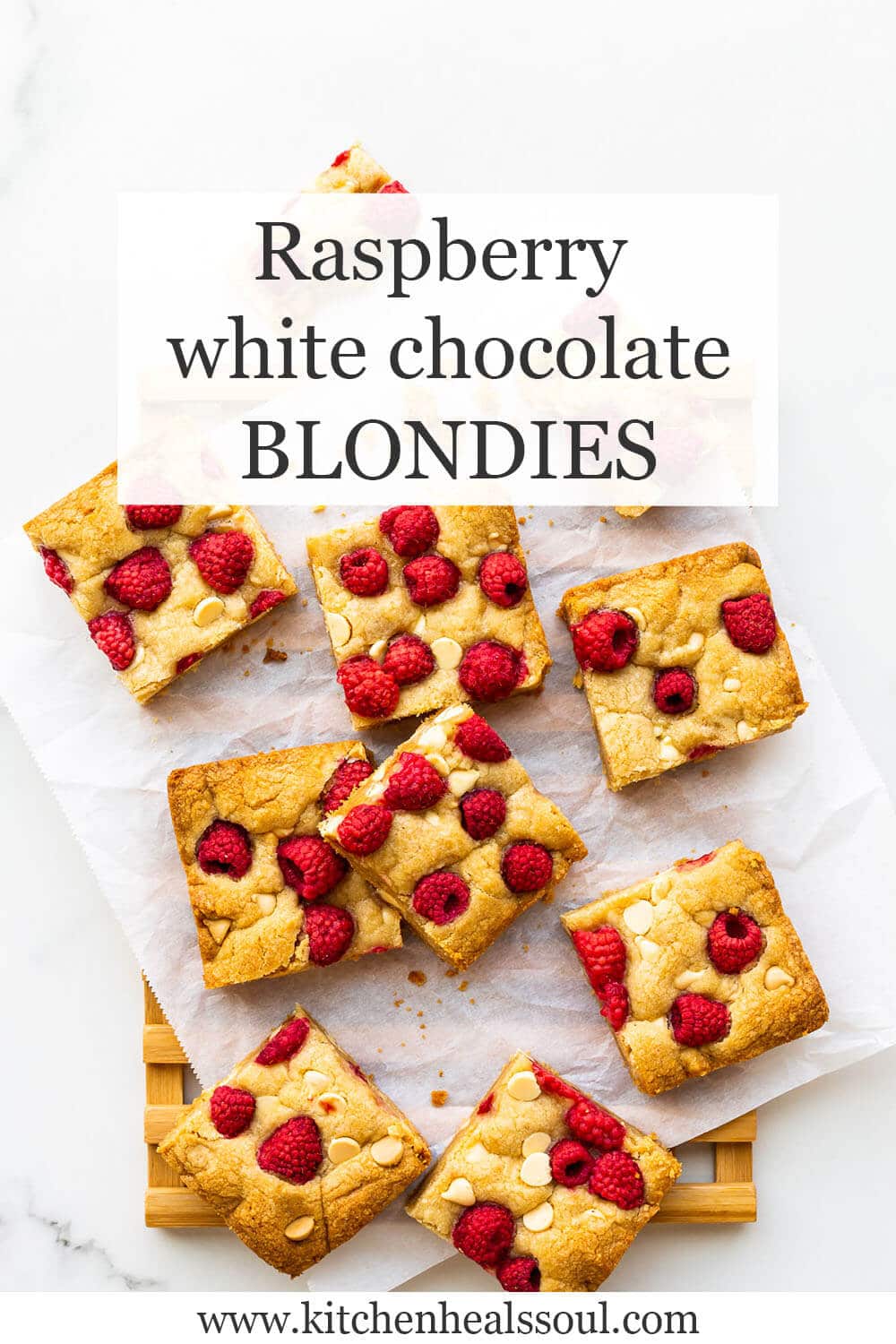 White chocolate chip blondie bars topped with raspberries