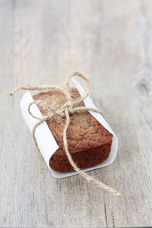 Mini banana bread cake wrapped in parchment and tied with natural twine