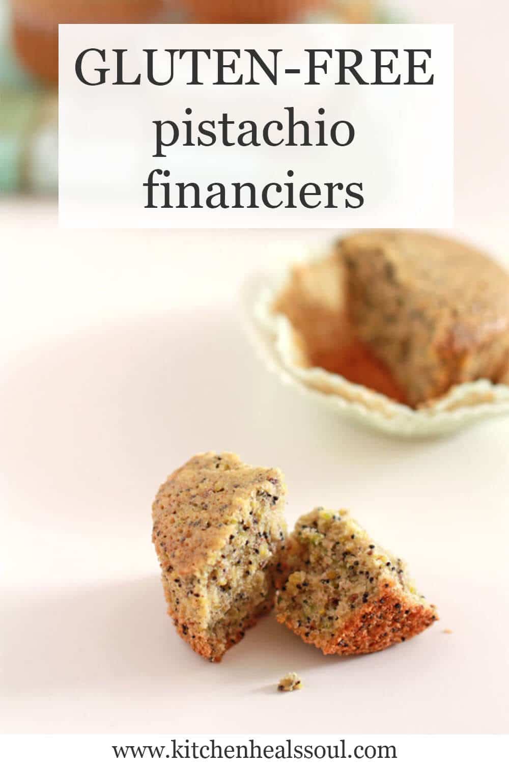 Financiers cakes, one broken open to show the crumb laced with black poppy seeds