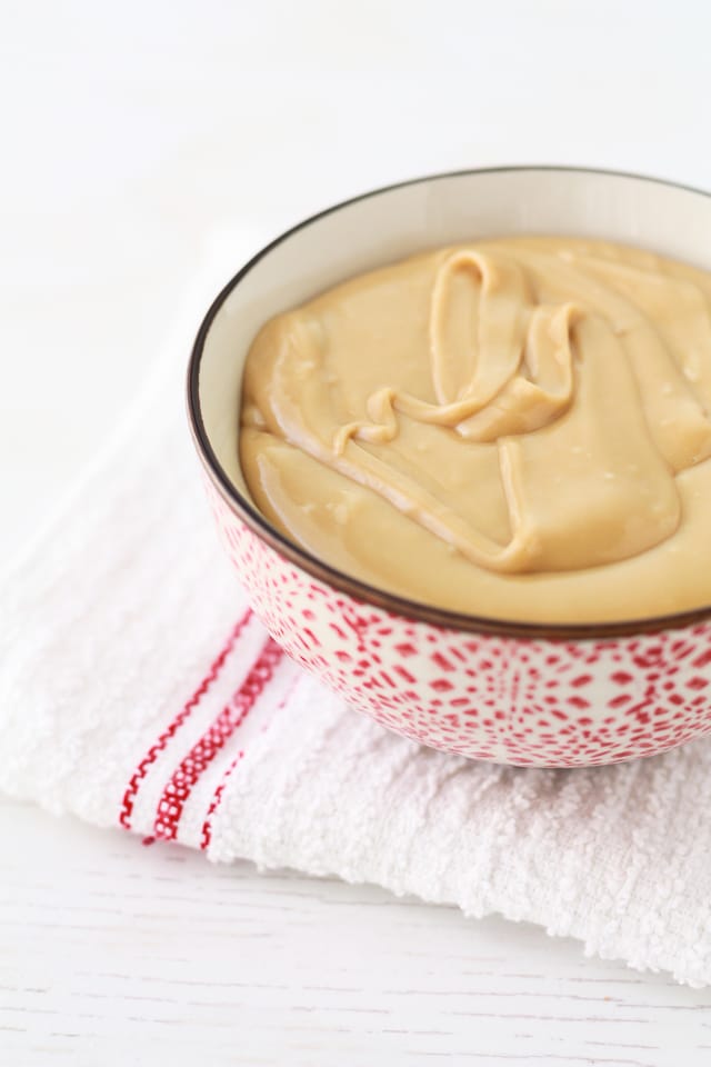 Homemade maple butter in a red and white bowl