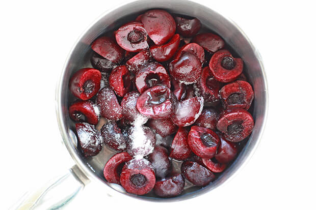 Making bourbon cherries from fresh cherries in a saucepan