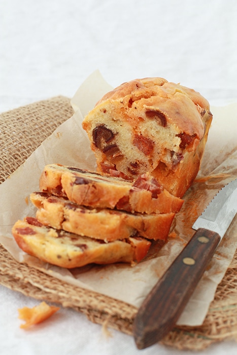 chorizo date loaf sliced with serrated knife to serve