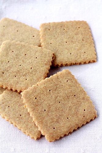 A scattered pile of homemade graham crackers