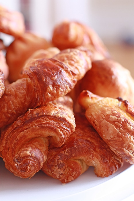 A platter of golden brown, flaky viennoiseries. 