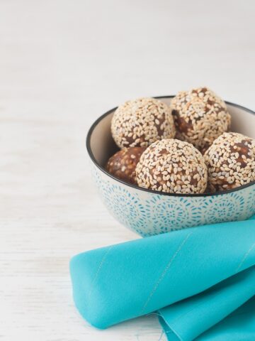 Bowl of sesame date truffles