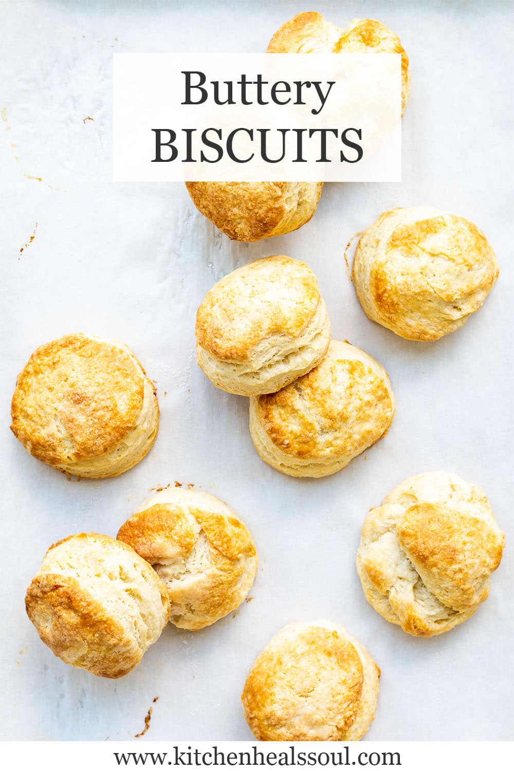 Flaky homemade biscuits on parchment paper