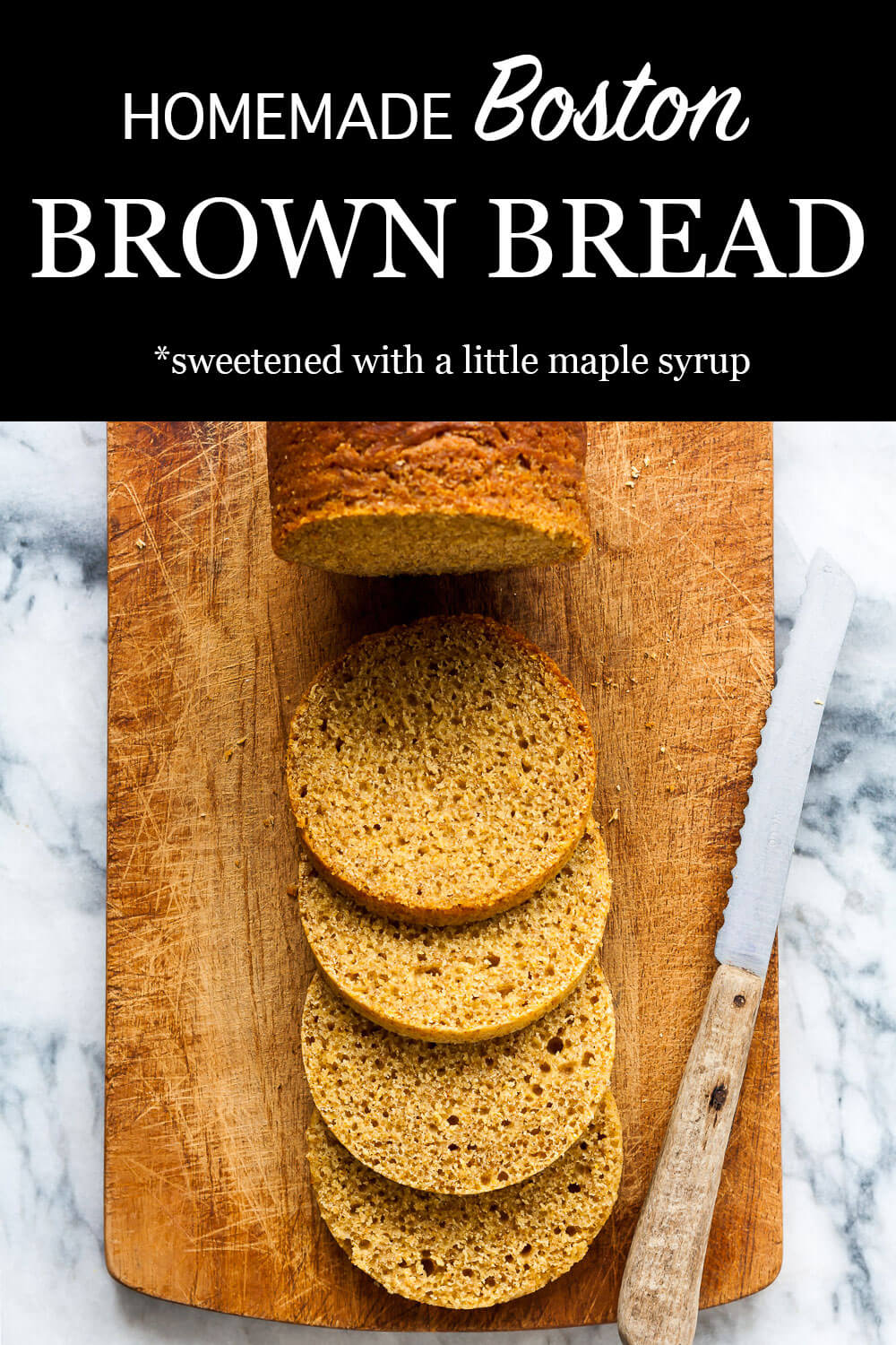 Boston brown bread sliced with a serrated knife on a wood cutting board