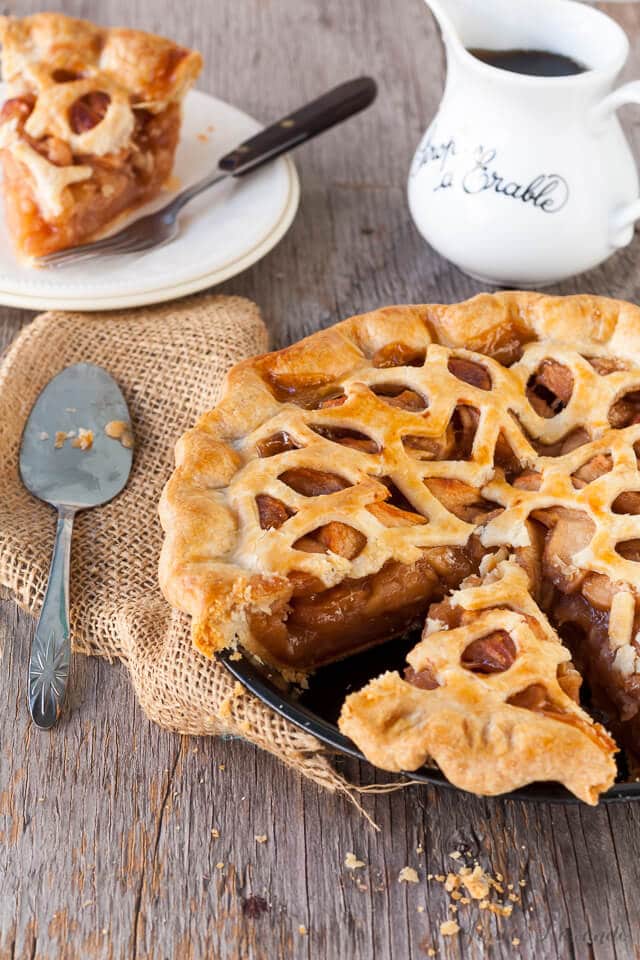 Sliced maple apple pie being served.