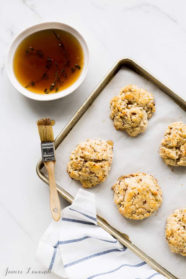 Bourbon-maple glazed cheddar bacon biscuits | bakeschool.com