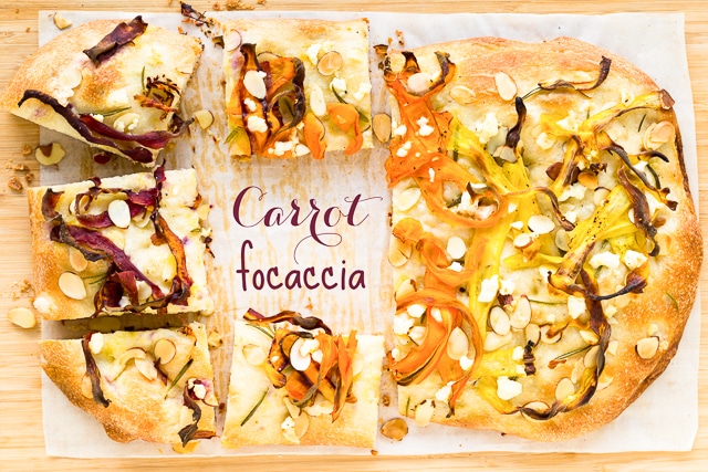 carrot focaccia with sliced almonds and feta cheese