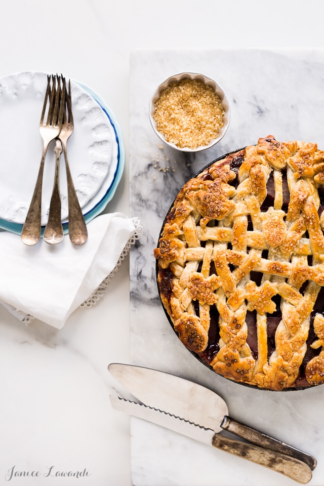 red wine-poached pear pie made with an all-butter flaky pie crust