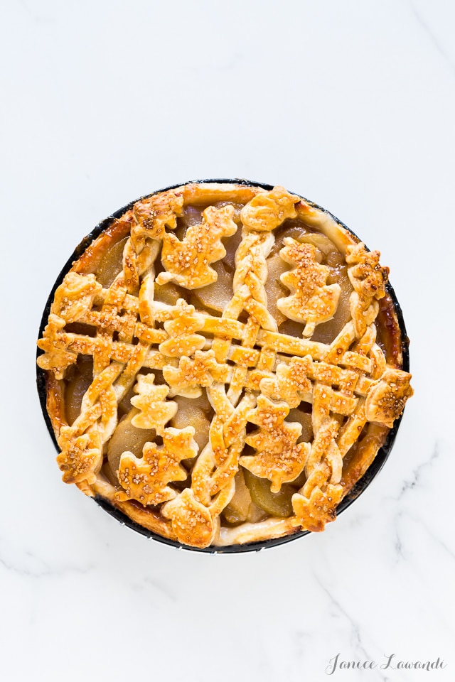 rosé wine-poached pear pie made with an all-butter flaky pie crust