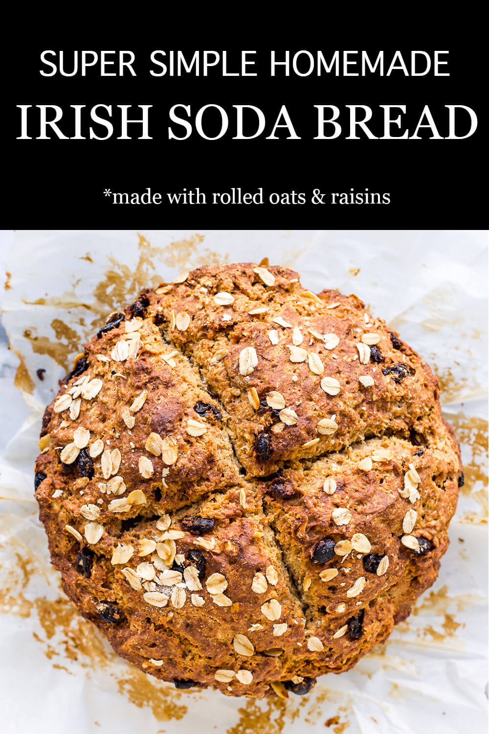 Golden brown loaf of homemade Irish soda bread with raisins and rolled oats scored into 4 sections