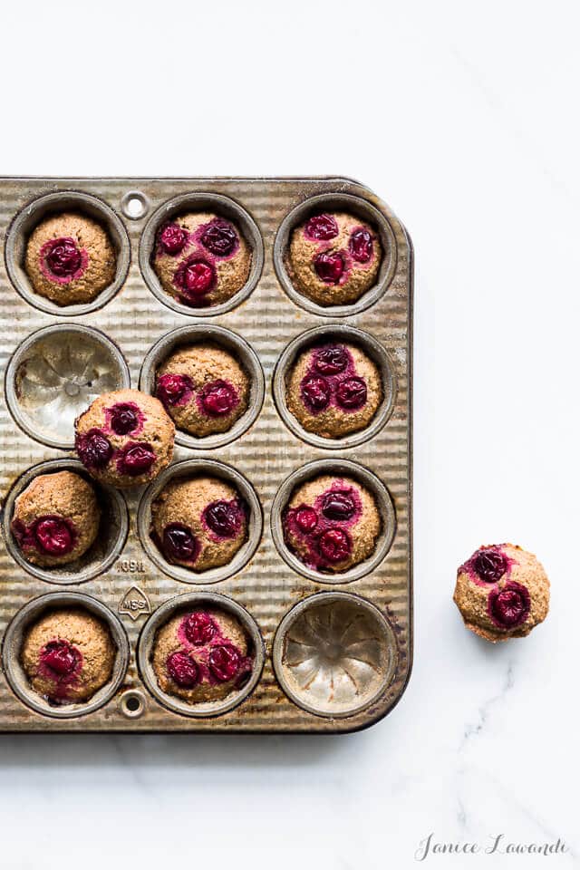 Baked cranberry chestnut financiers in a decorative vintage pan