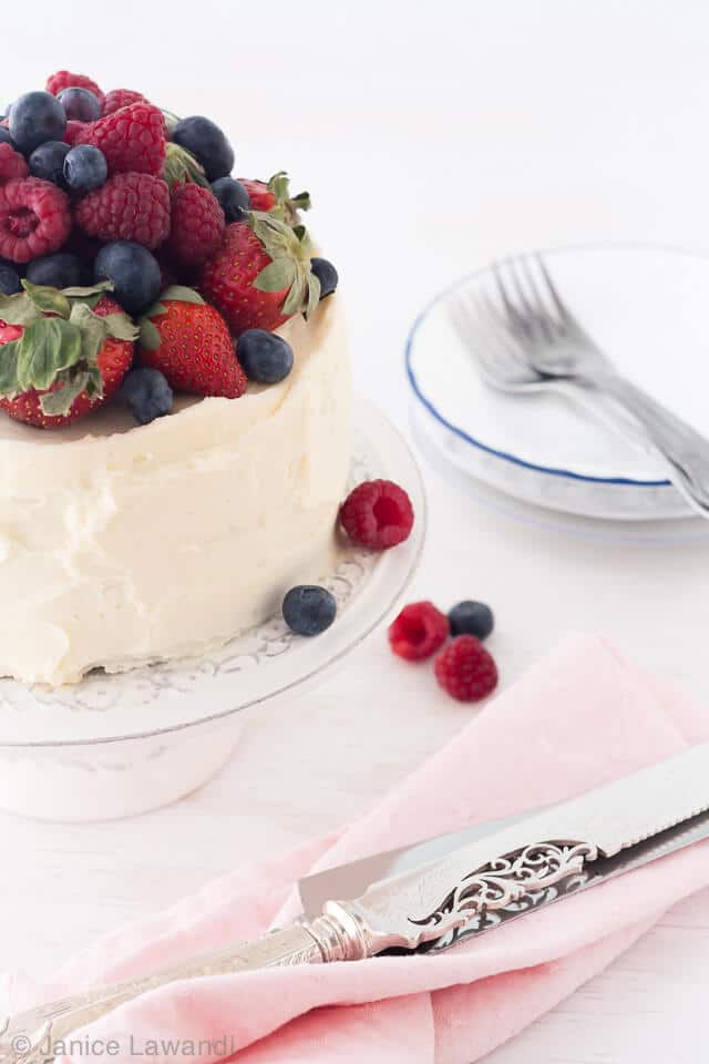 Chocolate layer cake with berries and cream cheese frosting