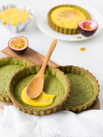 Filling matcha tarts with passion fruit curd filling