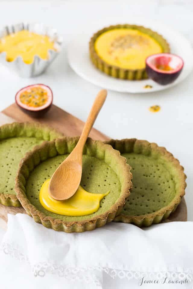 Filling matcha tarts with passion fruit curd filling