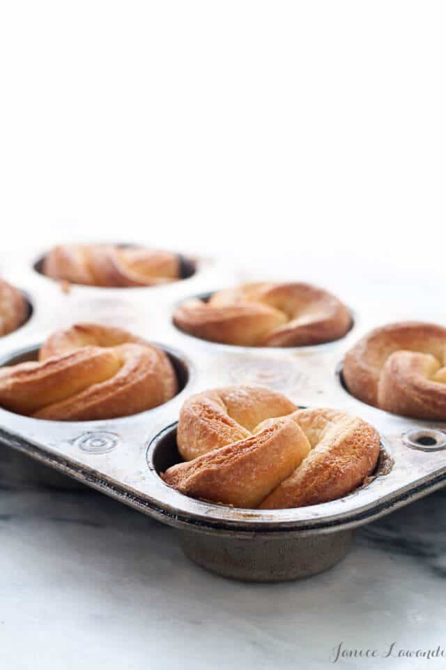 maple brioche buns after baking in a muffin pan