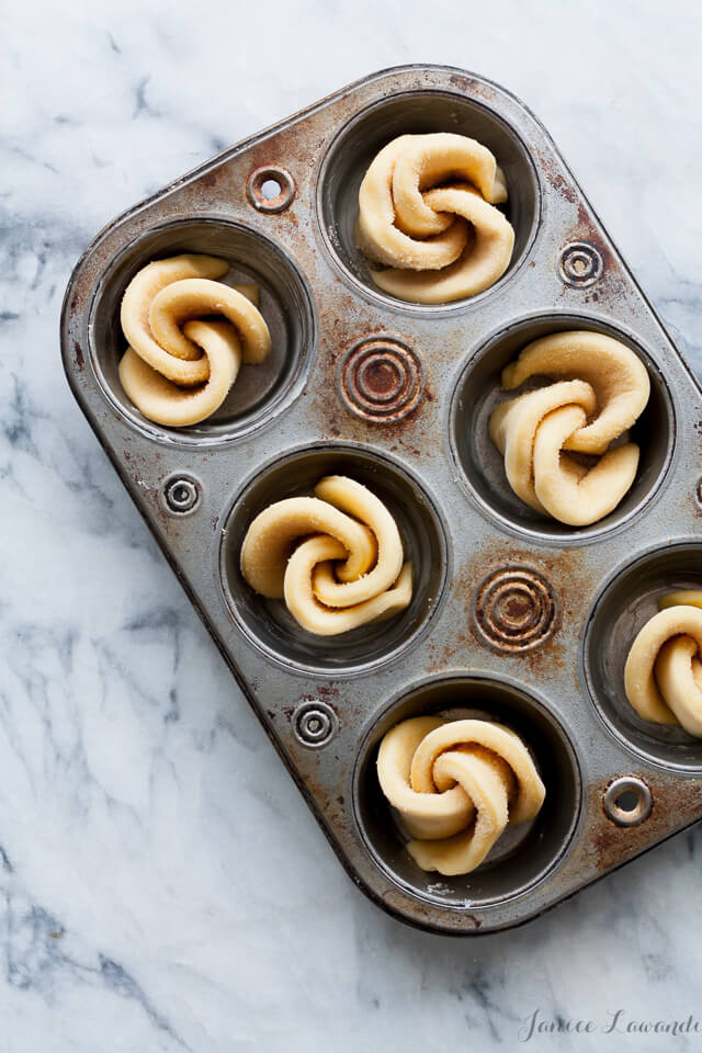 maple brioche buns before baking in a muffin pan