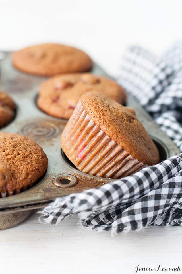 Gingerbread cranberry muffins flavoured with gingerbread spices, molasses, and tart cranberries