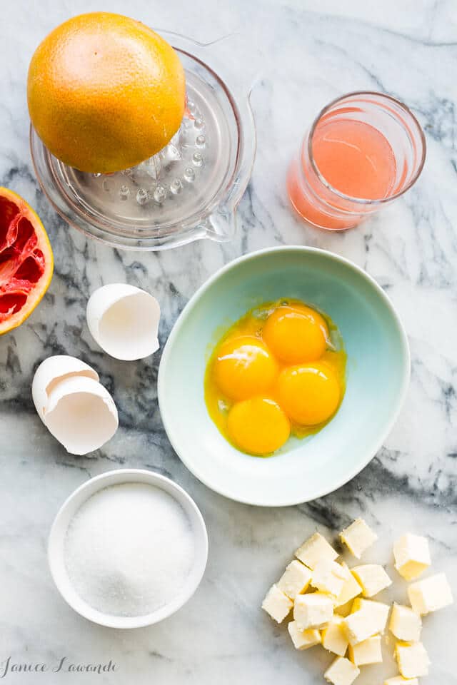 Grapefruit curd ingredients - fresh pink grapefruit, egg yolks, sugar, and lots of butter