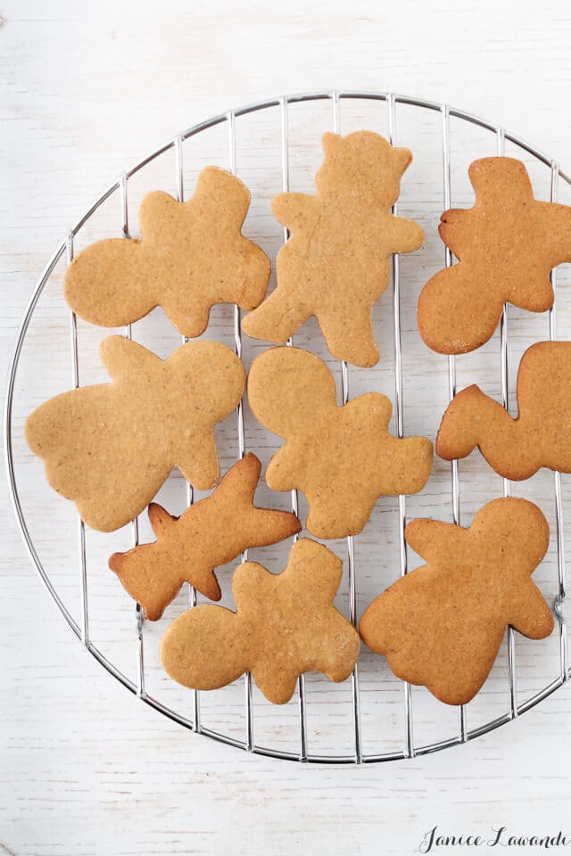 Gingerbread cookie cutouts on a cooling rack.