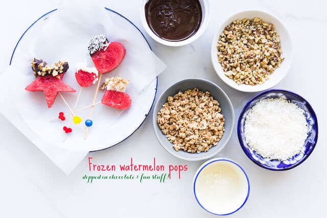 Frozen watermelon pops dipped into melted chocolate, granola, nuts, coconut and other fun toppings