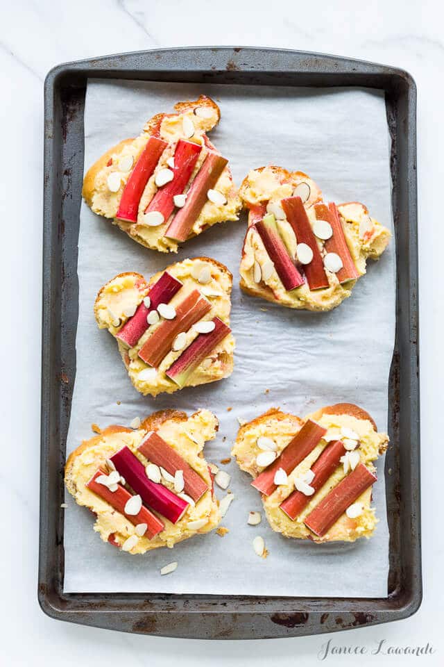 Orange blossom rhubarb bostocks are made from frangipane and baked in the oven until golden brown