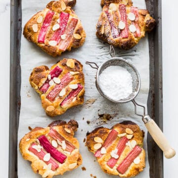 Perfectly golden brown orange blossom rhubarb bostocks are made from frangipane and baked in the oven until golden brown