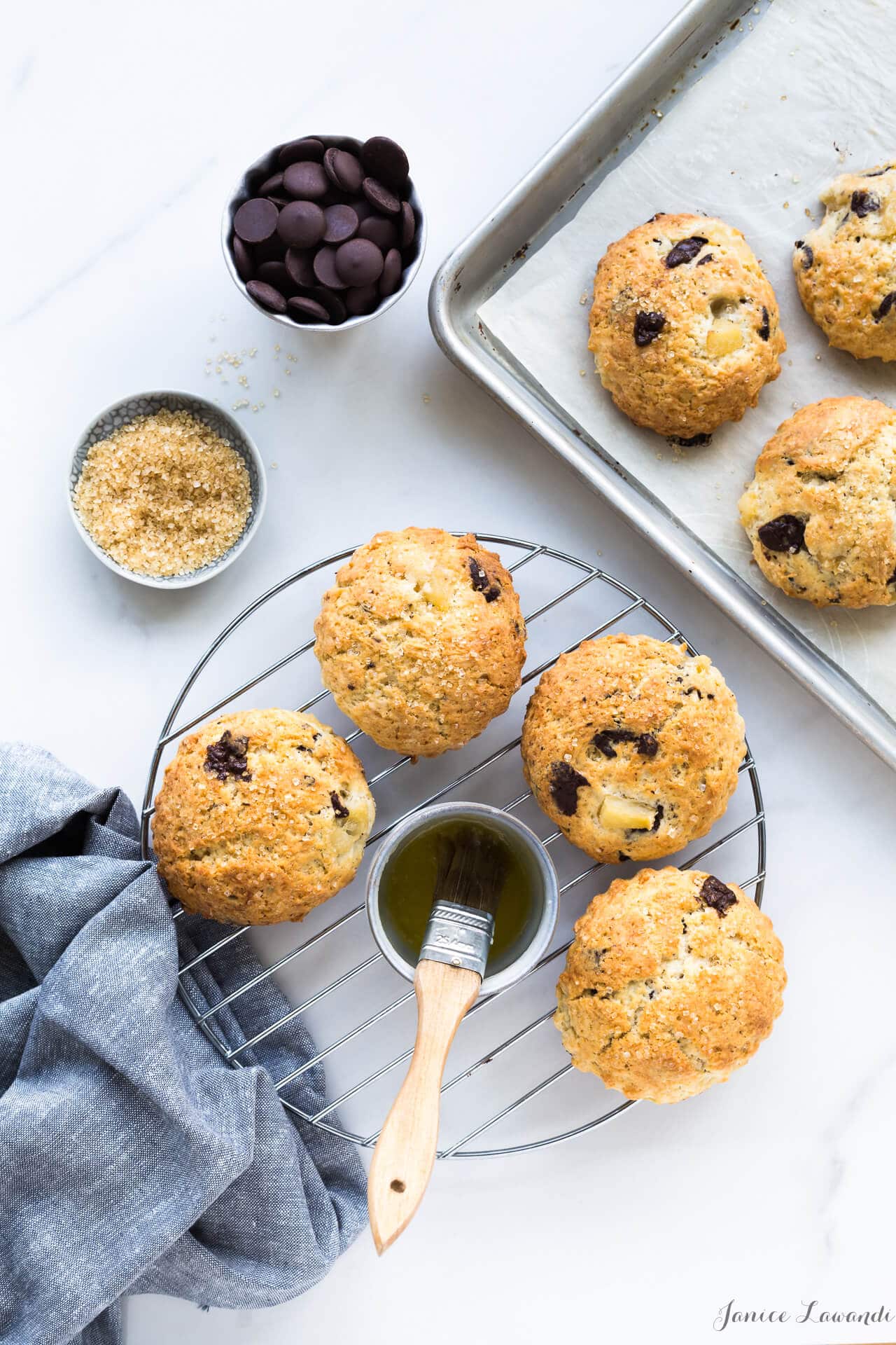 https://bakeschool.com/wp-content/uploads/2017/09/Pear-chocolate-scones-brushed-with-butter-and-sprinkled-with-turbinado.jpg