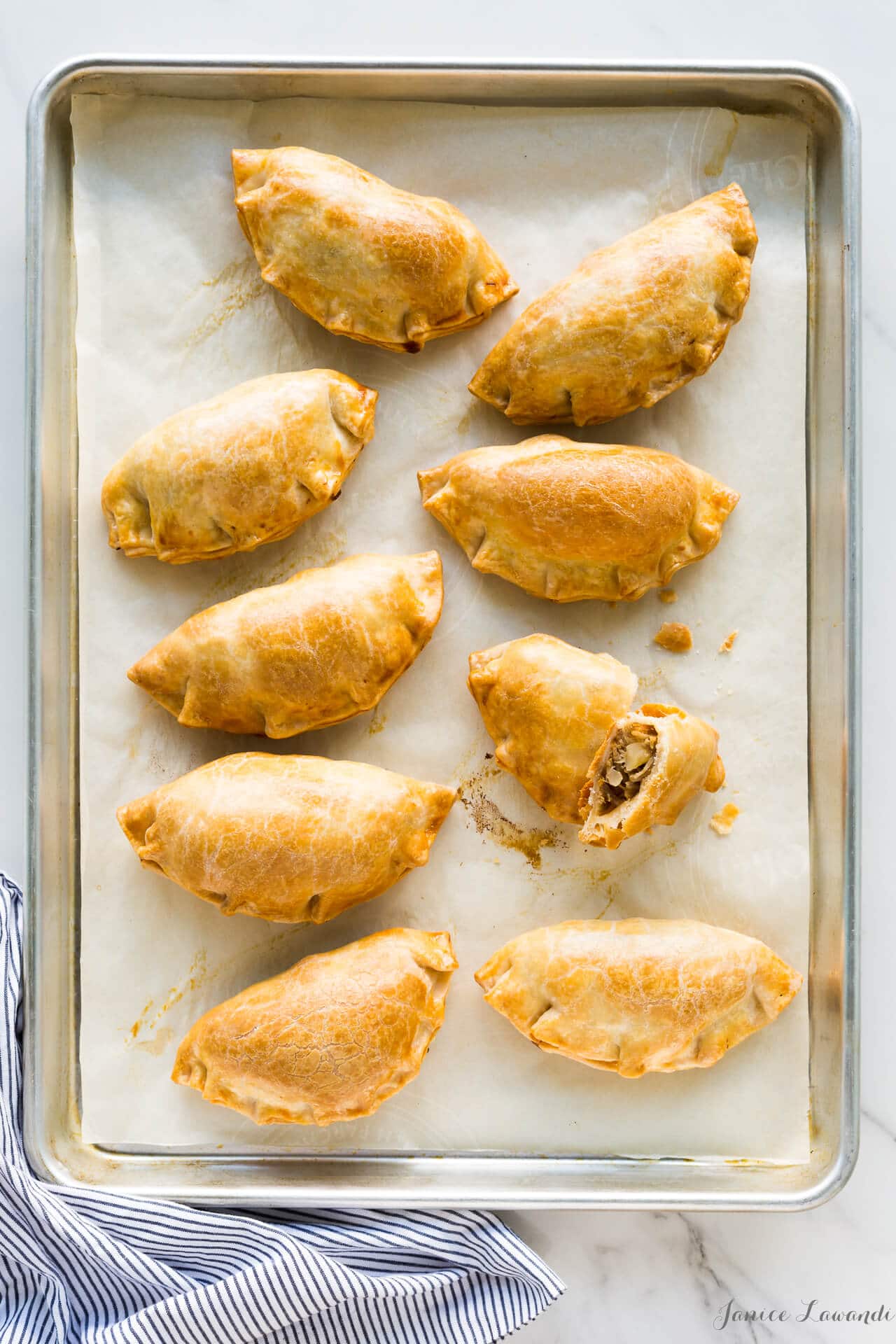 Freshly baked golden brown savoury hand pies with Maple Leaf shredded pork, thyme and apple chunks