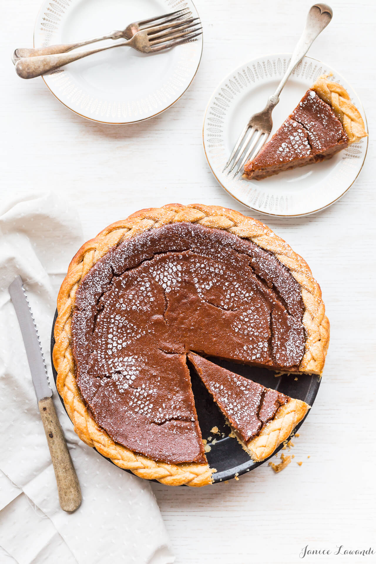 Apple butter pie - Stencil pie with powdered sugar to give it a lacy pattern, sliced and served on white plates