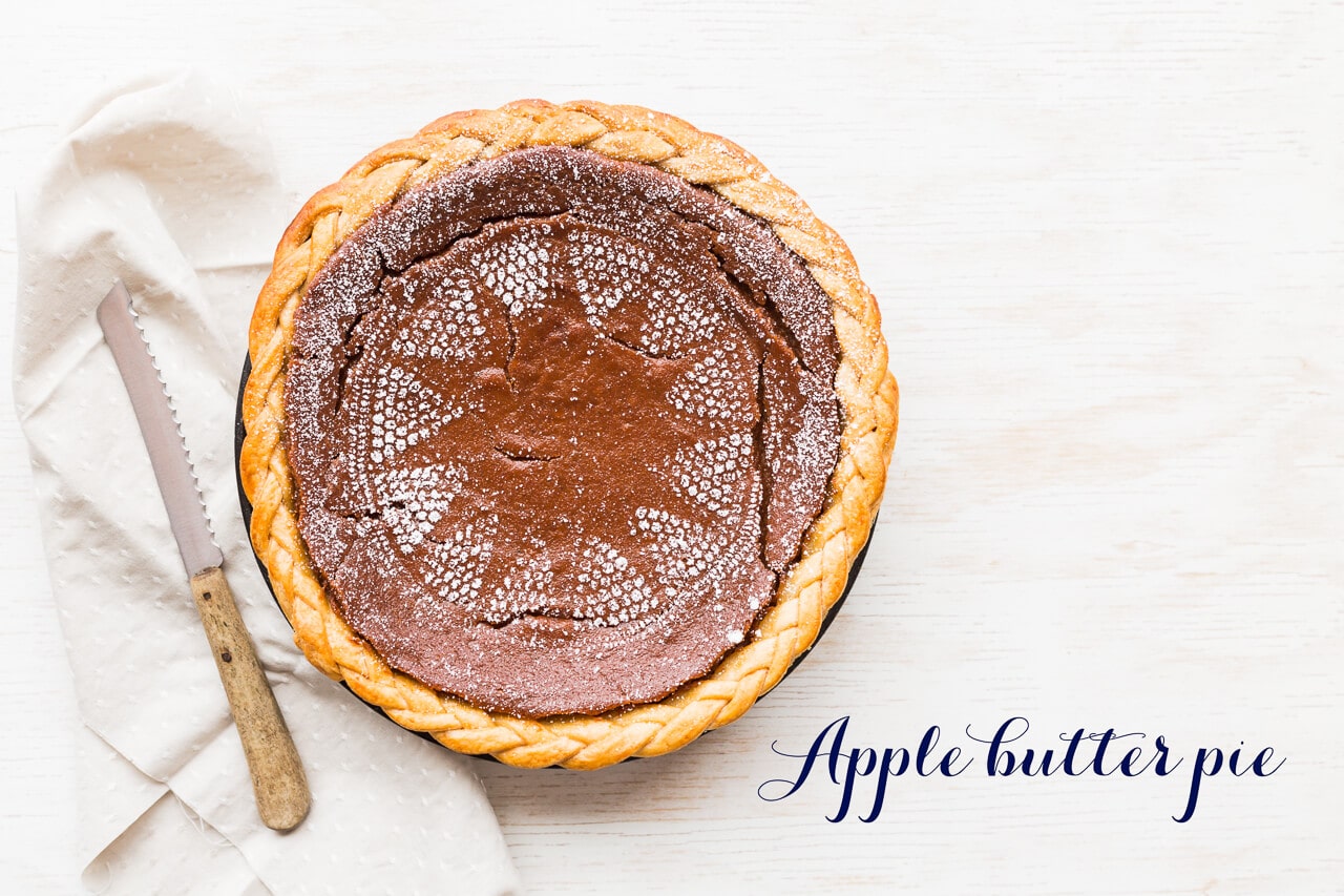 Apple butter pie with braided edge and lace stenciled on with powdered sugar