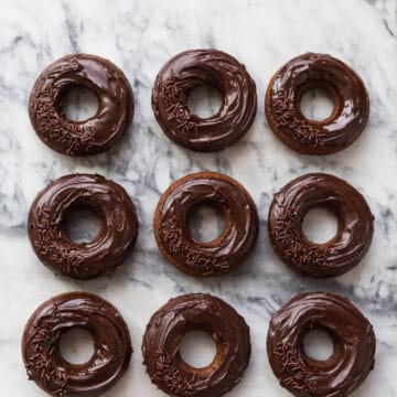 Baked chocolate donuts glazed with chocolate ganache