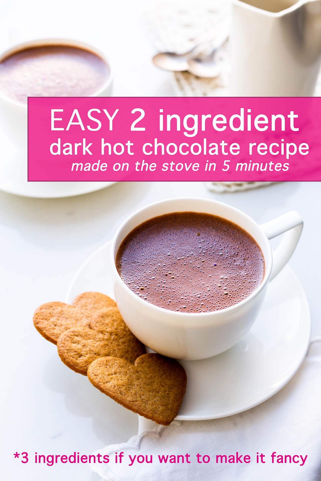 A cup of homemade dark hot chocolate served with heart-shaped cookies for valentine's day drink