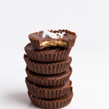 A stack of homemade chocolate sesame butter cups, just like peanut butter cups but with tahini instead of peanut butter