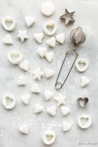 Cutting out marshmallows into mini hearts which can be used as toppings for chocolate pots de crème or hot chocolate