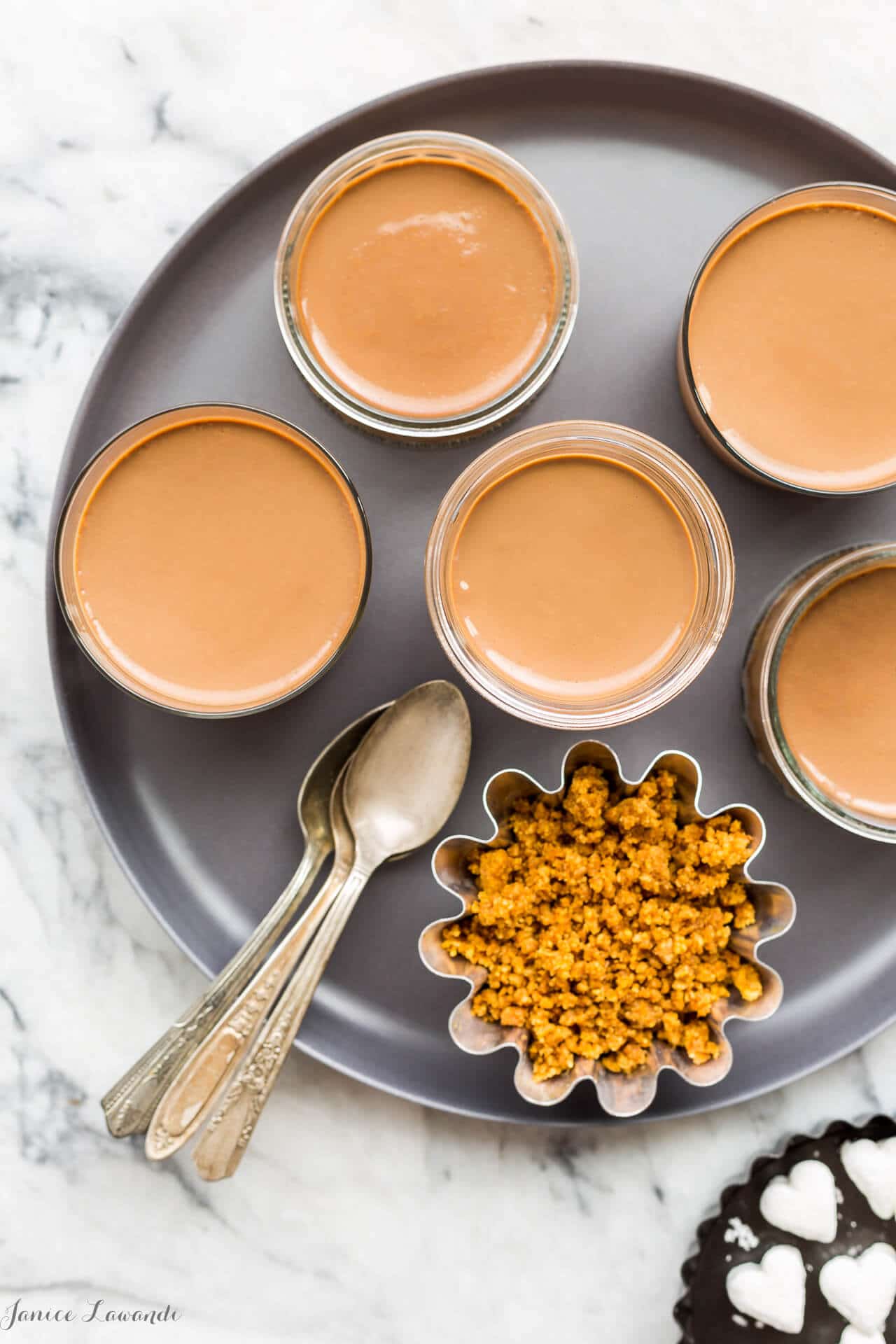 Silky milk chocolate pots de crème recipe served in jars.