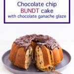 Bundt cake with chocolate chips and swirls of thick chocolate glaze being sliced and served from a grey serving platter