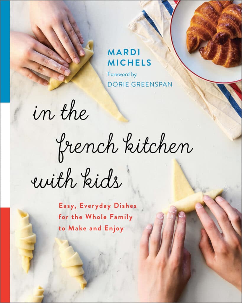 In The French Kitchen With Kids by Mardi Michels book cover featuring kids rolling homemade croissants