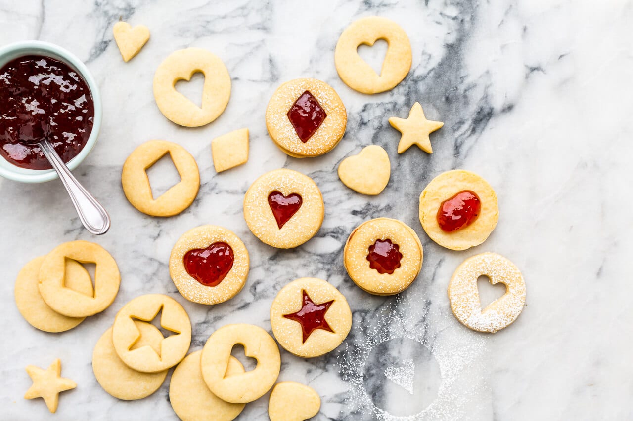 Classic holiday shortbread cutout cookies with strawberry jam filling