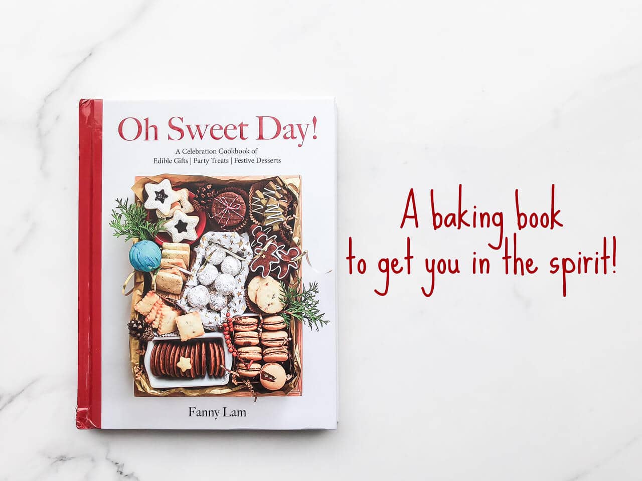 Book cover of Oh Sweet Day! baking book with a gift box filled with a variety of homemade cookies