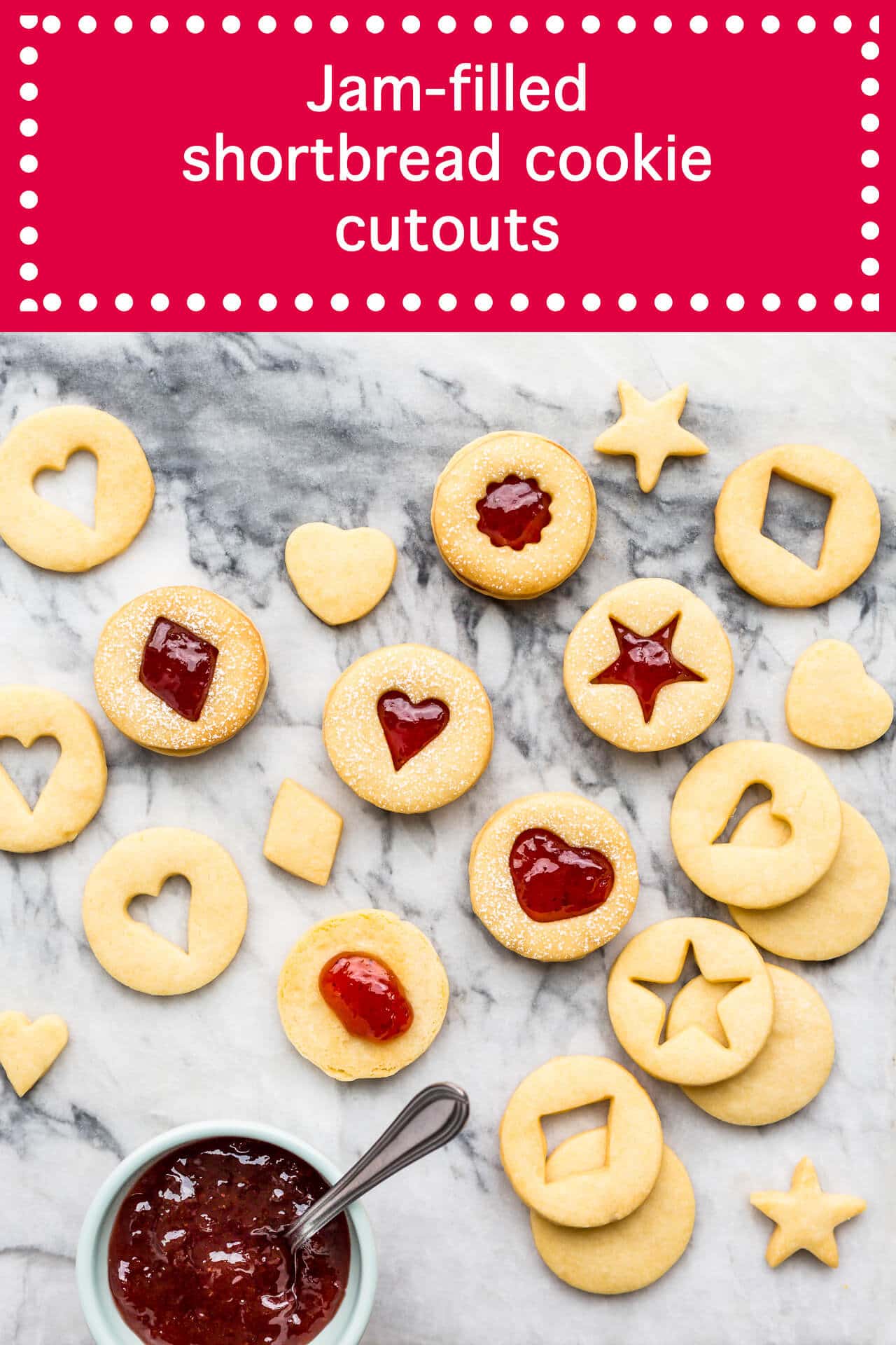 jam filled shortbread cutout cookies that hold their shape sandwhiched with strawberry jam and a bowl of jam with a spoon