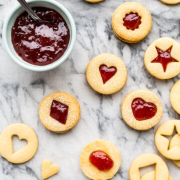 shortbread cutout cookies sandwiched with strawberry jam filling