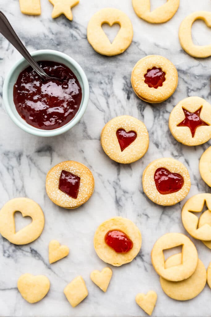 shortbread cutout cookies sandwiched with strawberry jam filling